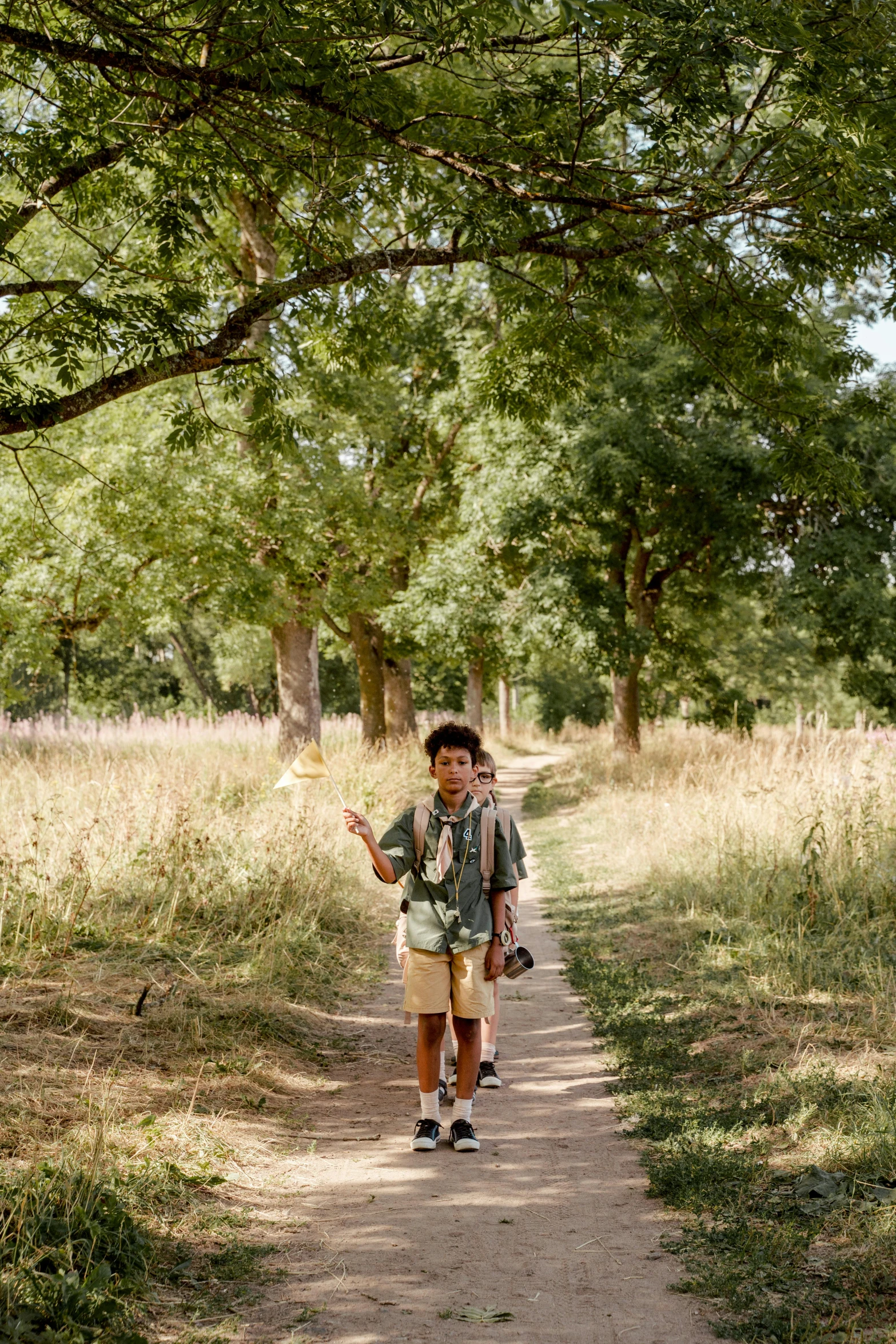 a  is walking down a dirt road