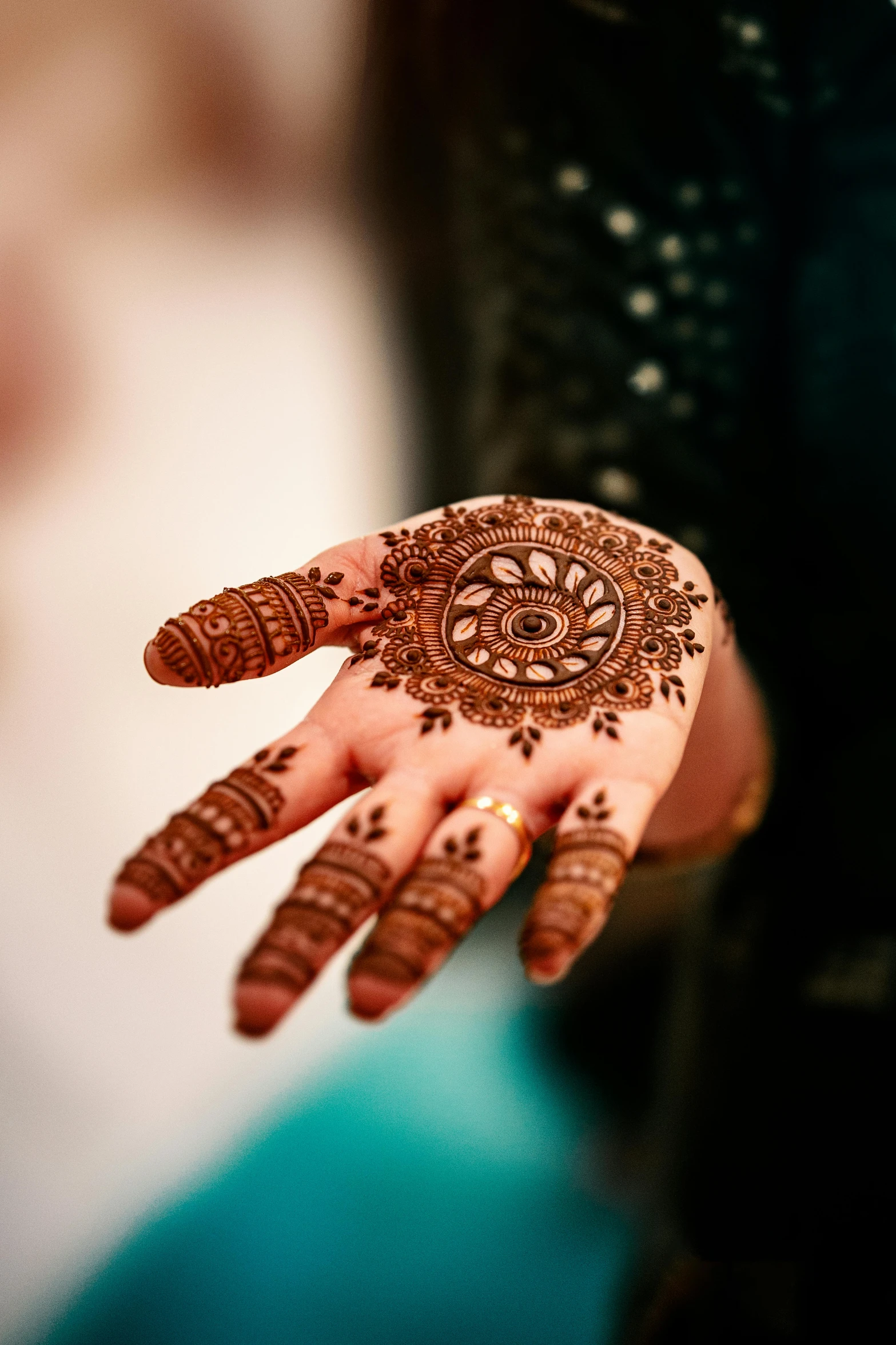 the hands and hands of a bride with henses painted on them