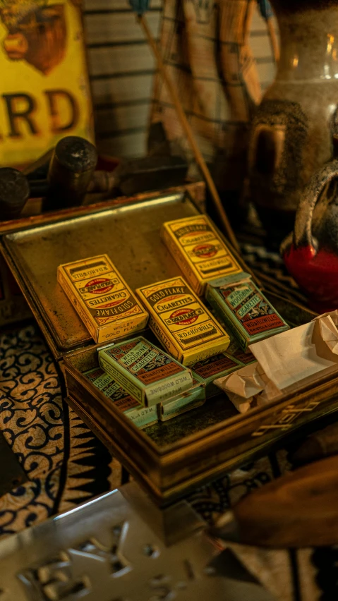 several small boxes of tobacco sit on a table