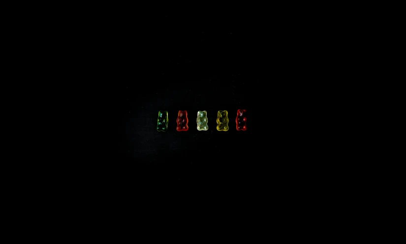 the word jesus is displayed in green, red, and yellow lights