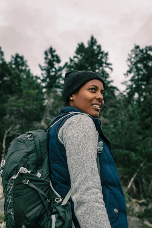 a close up of a person in front of trees