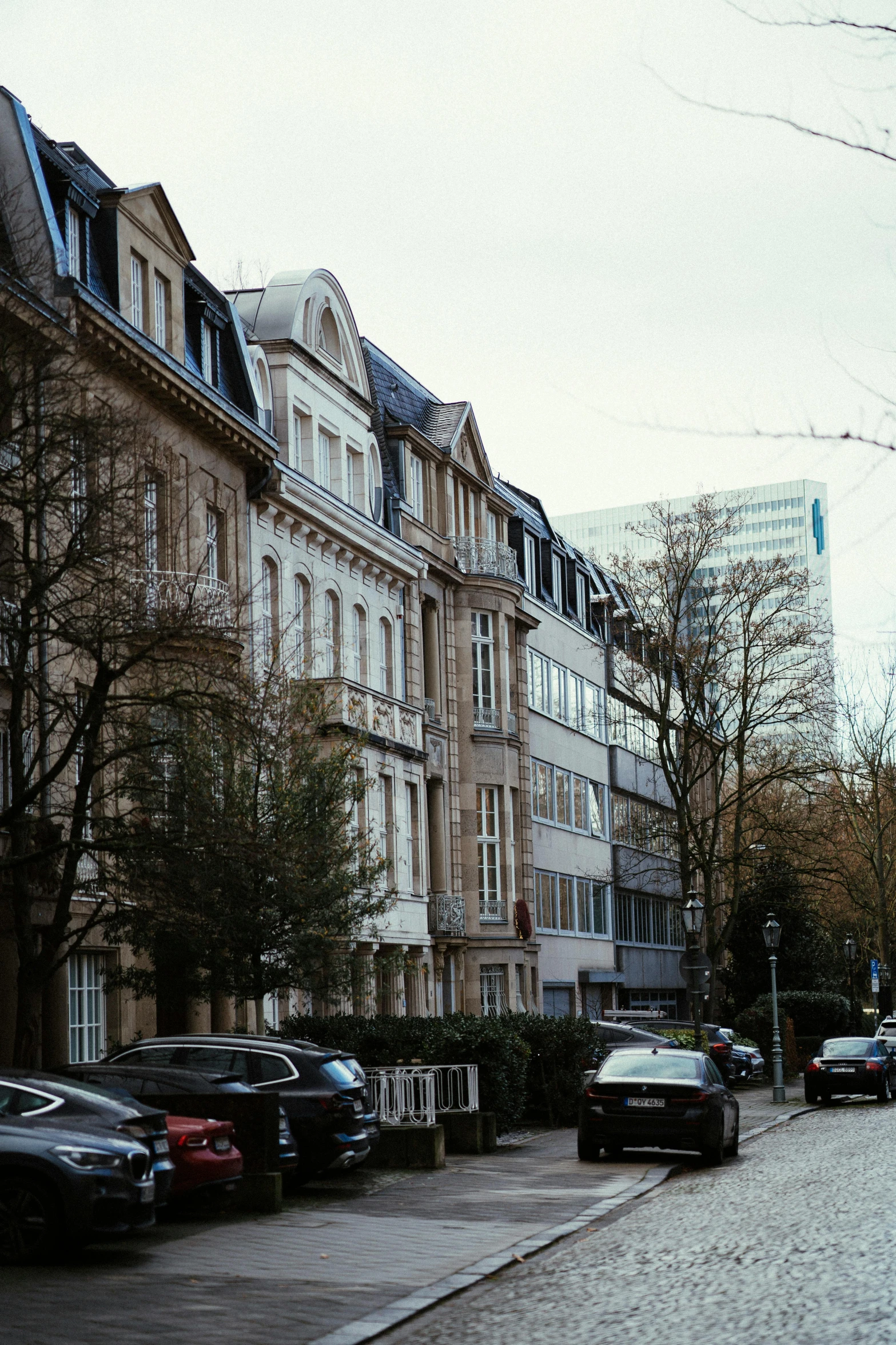 a street with cars parked in front of buildings