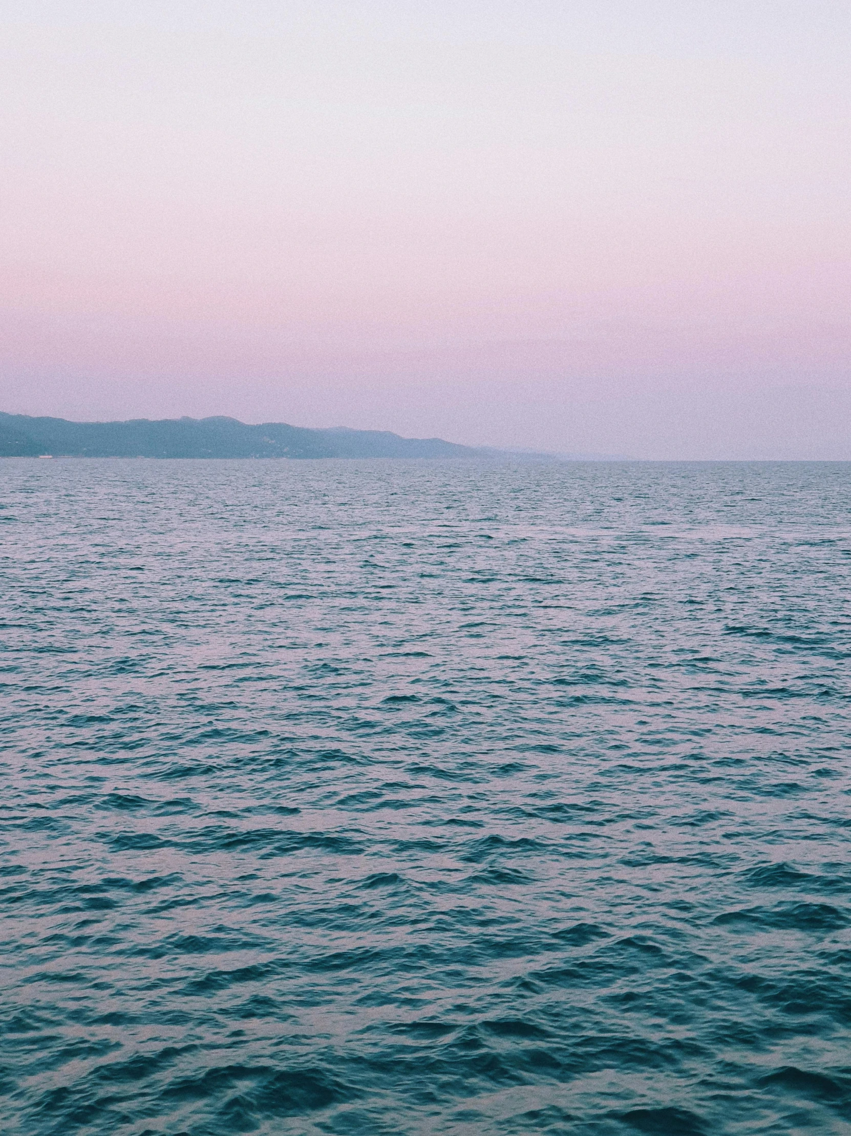 a view from a boat at the ocean with no one around