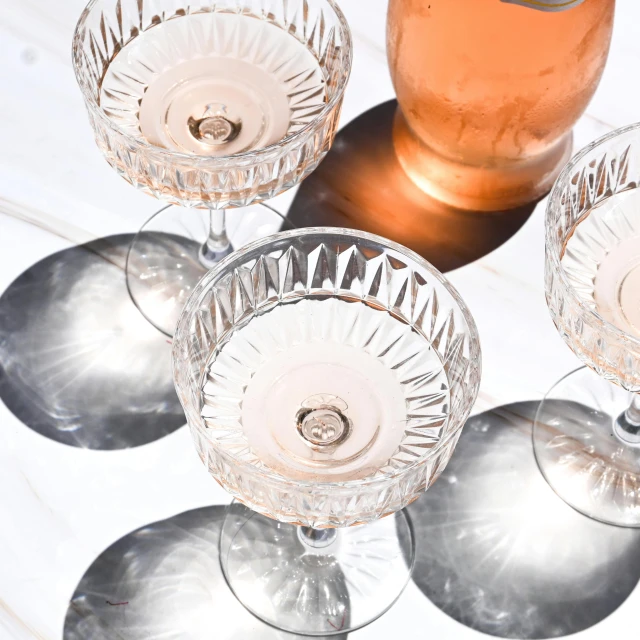 a view of some champagne glasses in a row