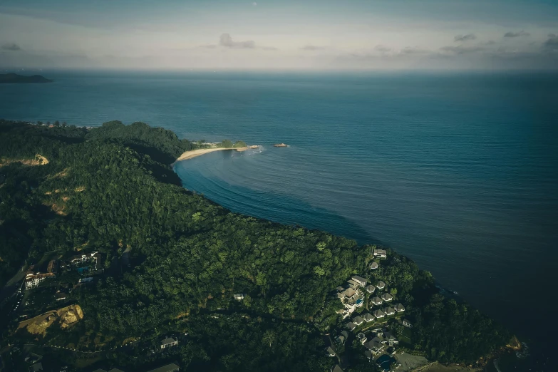 a body of water with some green trees near by