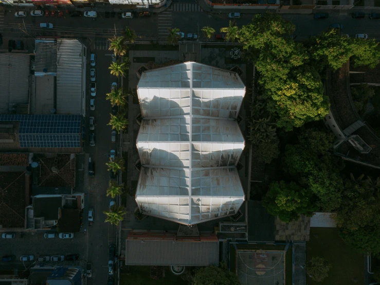 a large umbrella sits atop a parking lot