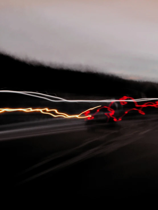 motion blur pograph of a car going fast in the night