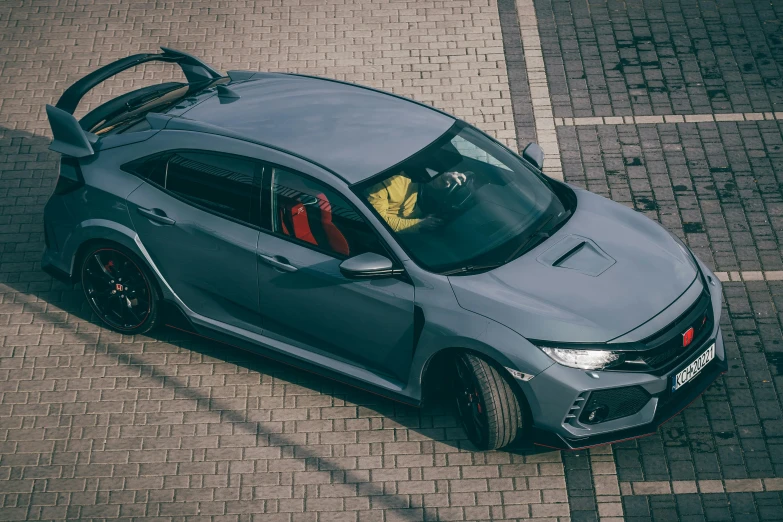 an overhead view of a gray and black car