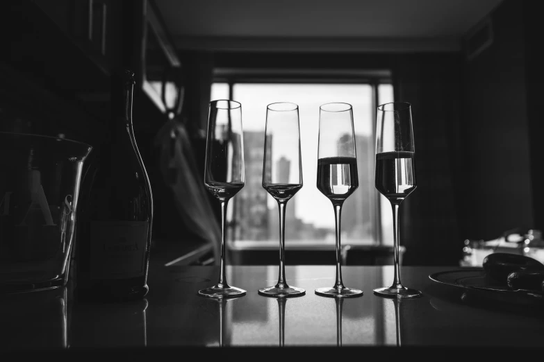 a black and white po of five champagne flutes