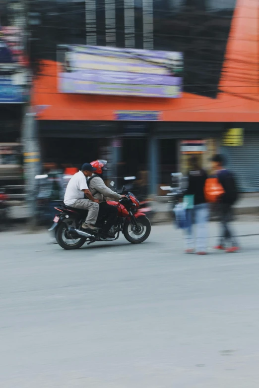 a person is riding a motorcycle on the street