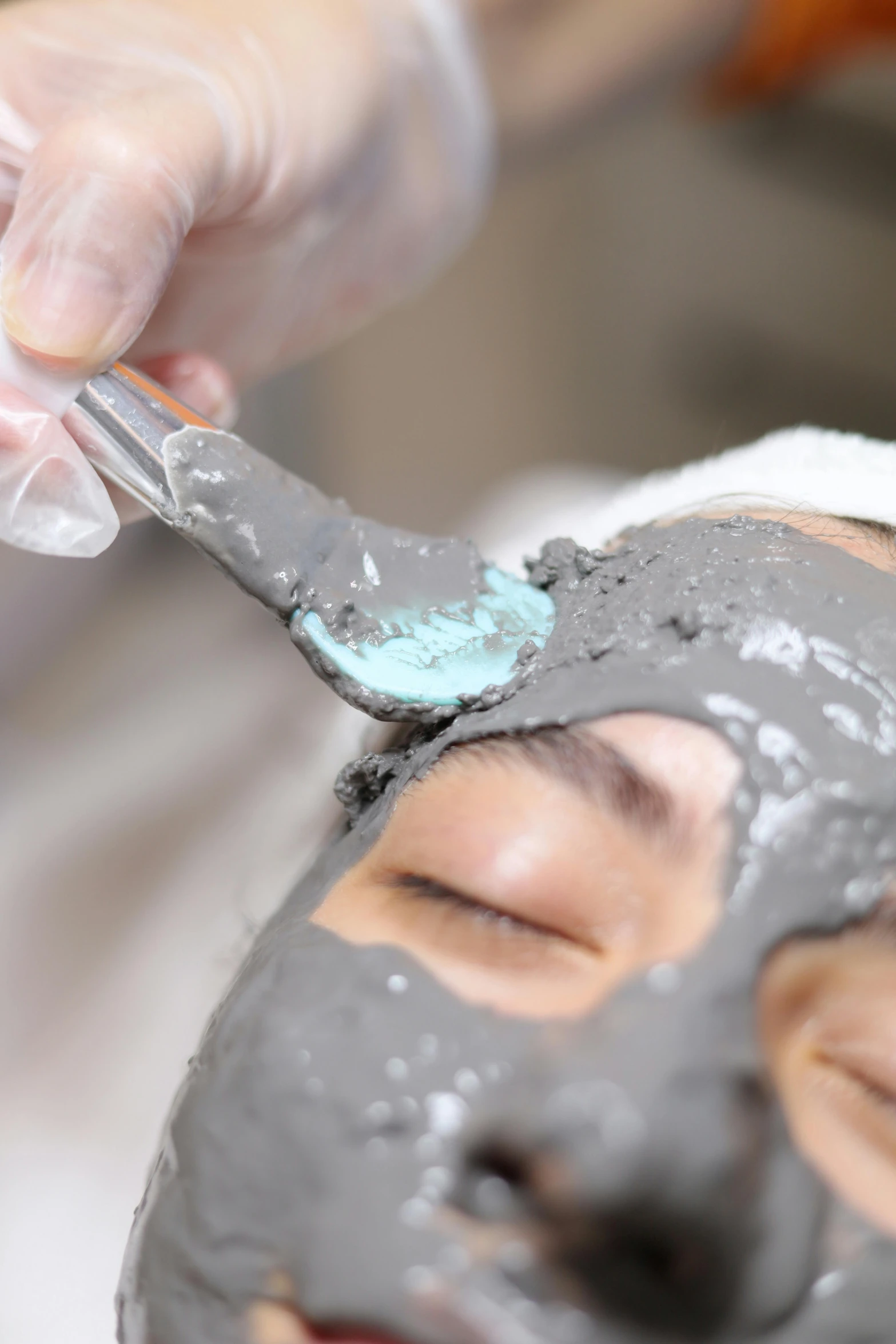 a woman is getting facial care in the salon