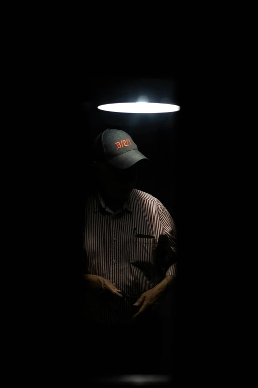 a man is walking around in the dark alone