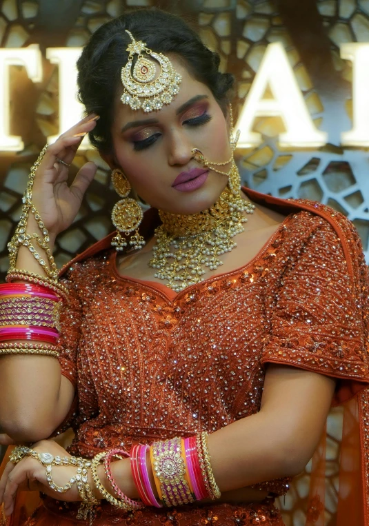 a woman wearing an elaborate jewellery set