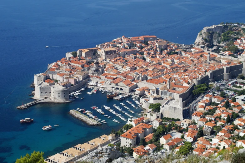 the old town is shown on an island with lots of water and red tile roofs