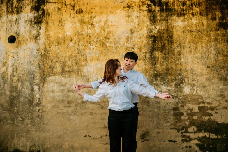 a man and woman are standing next to each other