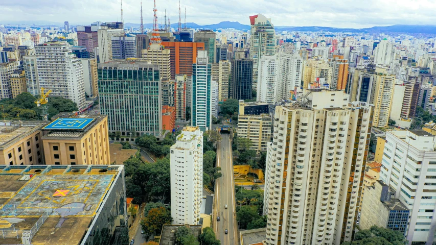 a cityscape with tall buildings and the sky scrs