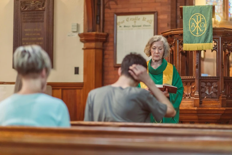 the women is in church alone during the service