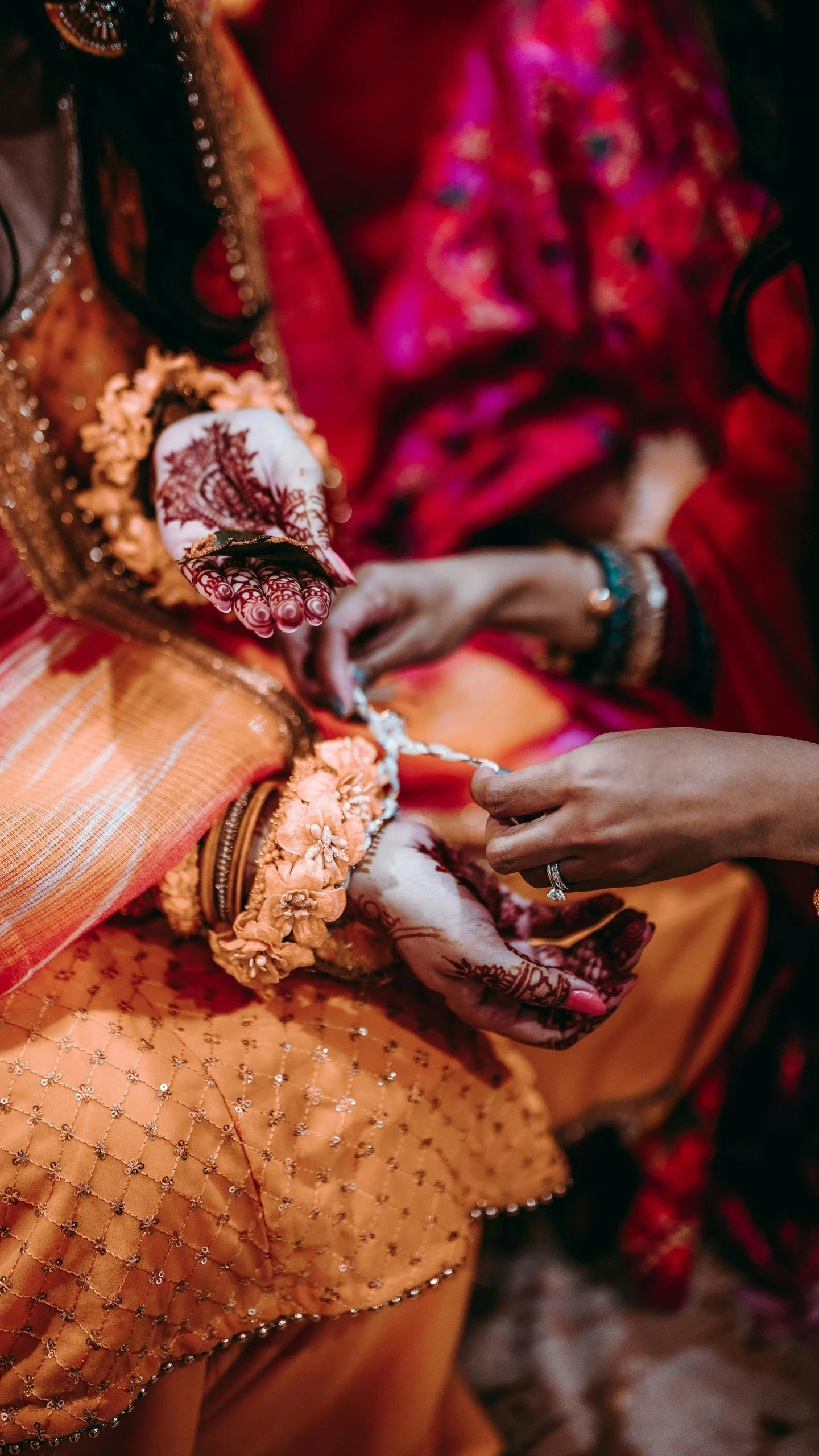 a person doing some kind of lace work on a dress