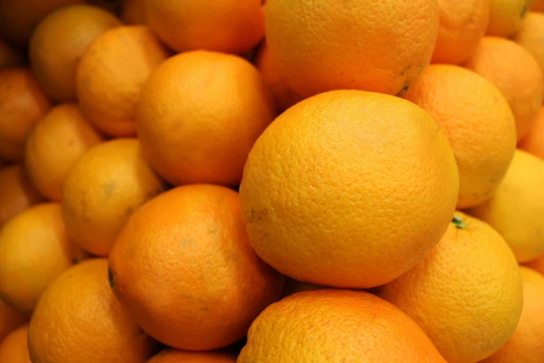 an image of some oranges that are piled up