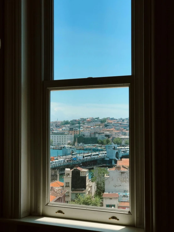 the city seen through an open window with no curtains