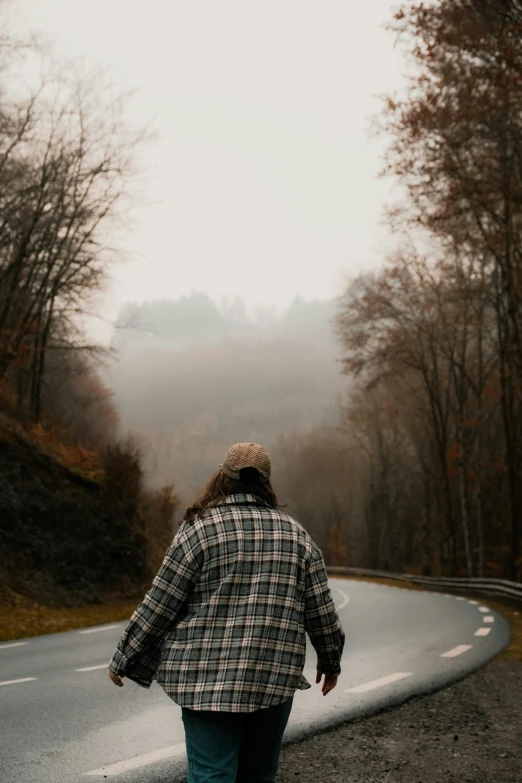 a person walking in the road alone