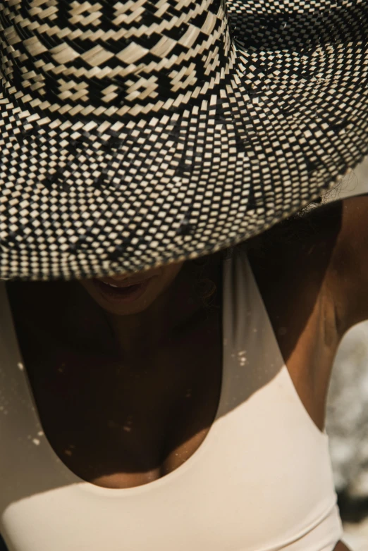 a woman in a white and black hat