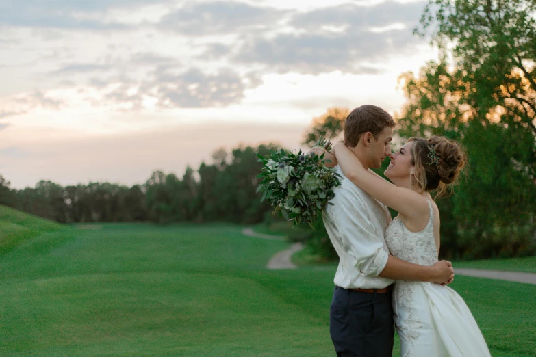 a couple on their wedding day, hugging each other