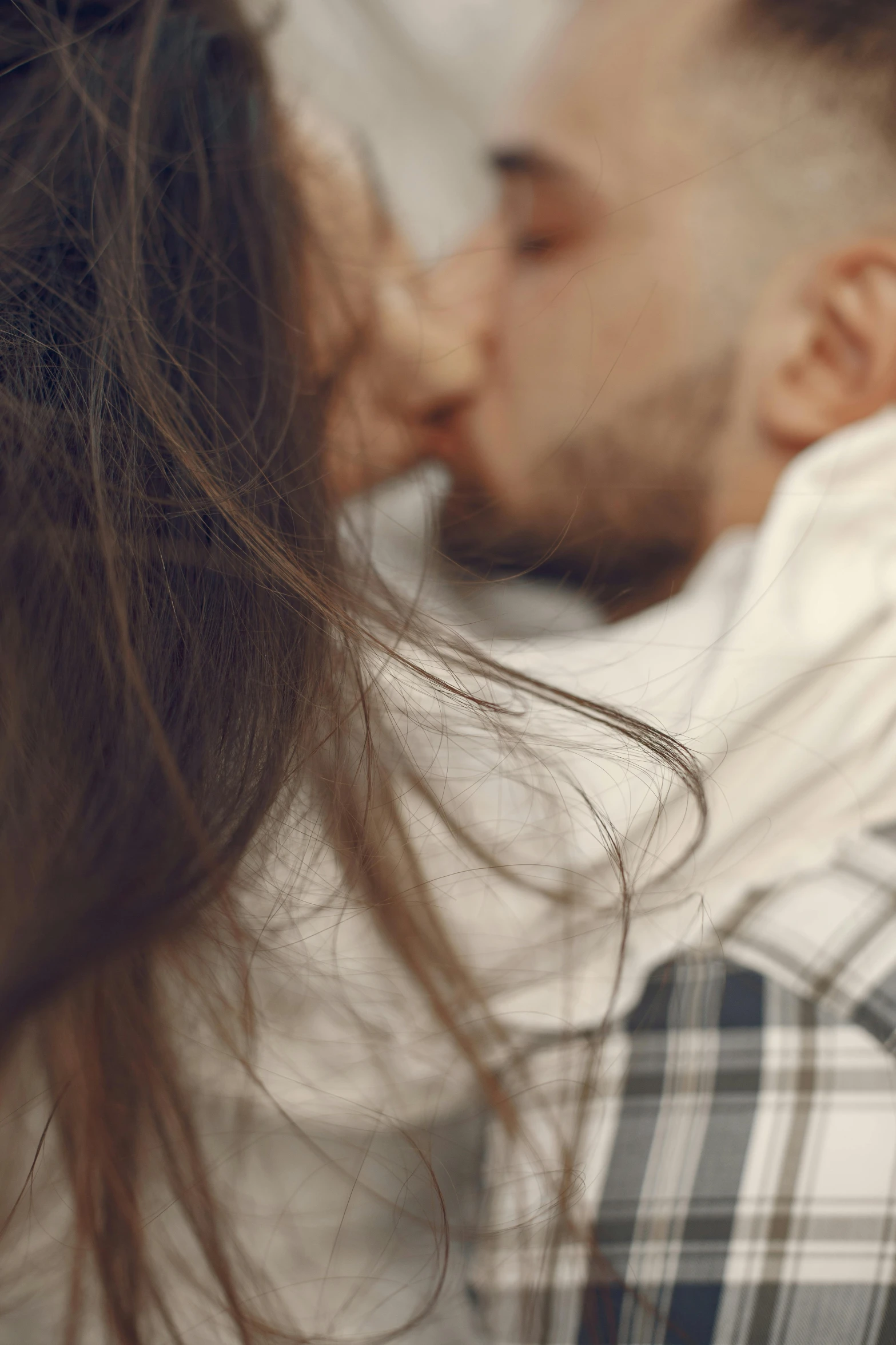 a woman kissing a man in front of her