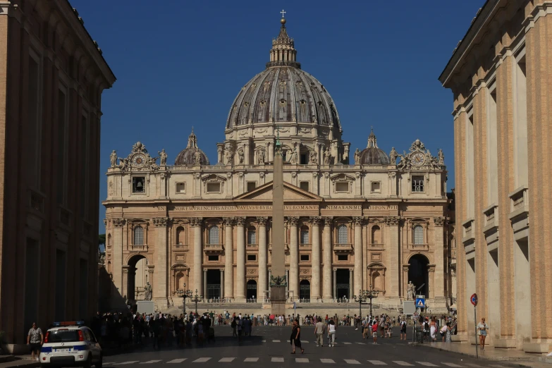 this is a large cathedral with lots of people around it