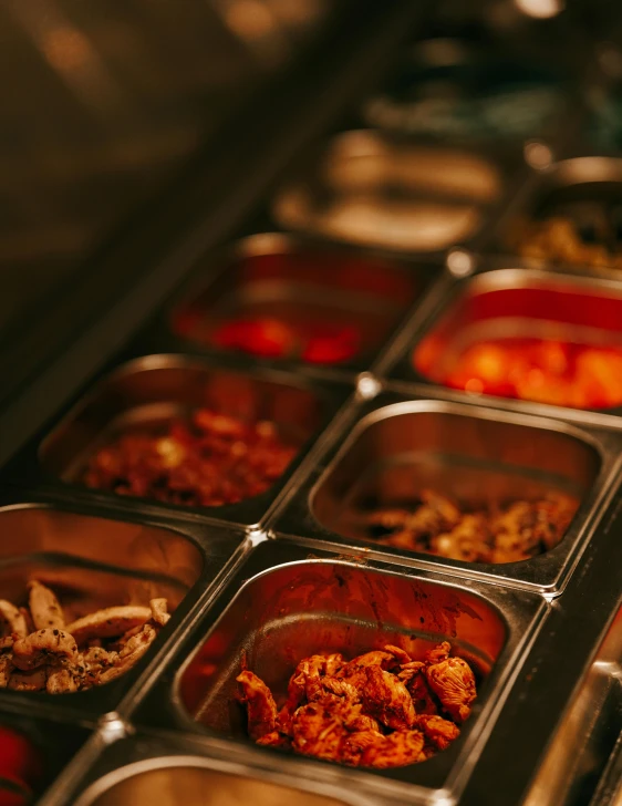 the buffet table has many prepared food items