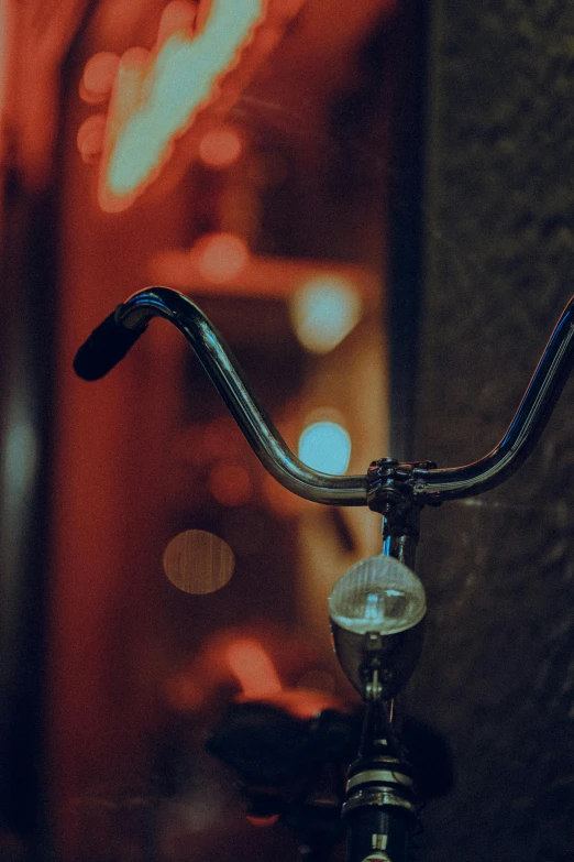 a bicycle handlebars with lights from the back