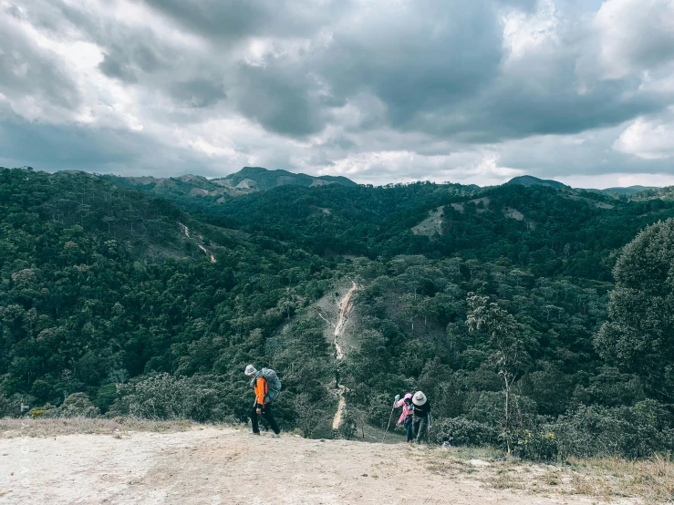 people are looking out at the view from a mountain