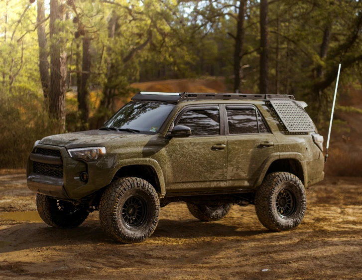 a very big suv with a lot of stuff on the roof