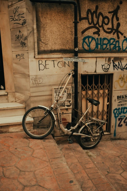 a bike is sitting next to the gate