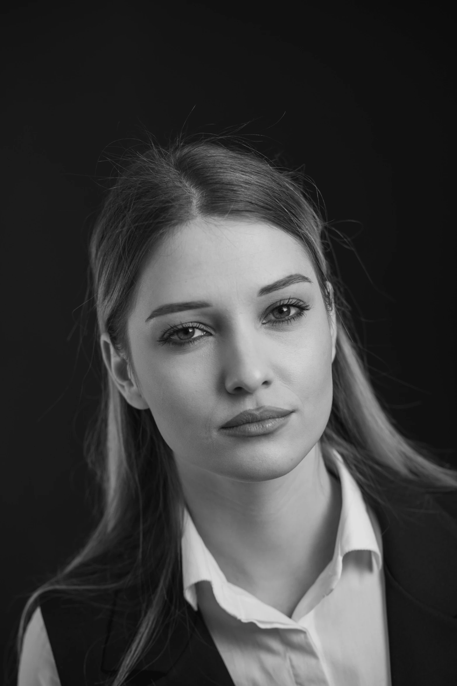 a young woman poses for a po