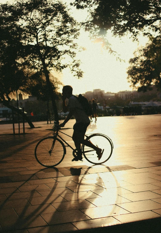 a person riding a bike on a city street