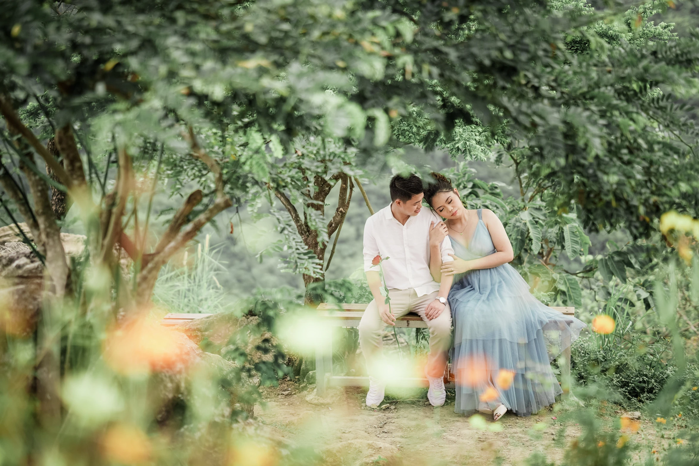 a couple of people that are sitting on a bench