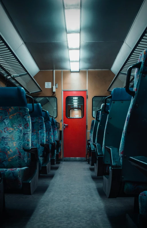 the interior of a train with seats and floor