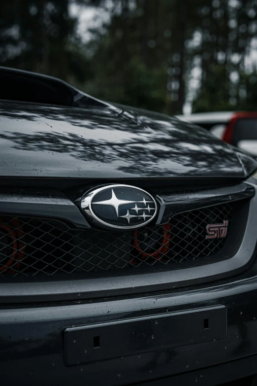 an emblem is on the grille of a black car