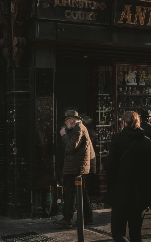 people on a sidewalk in front of a liquor store