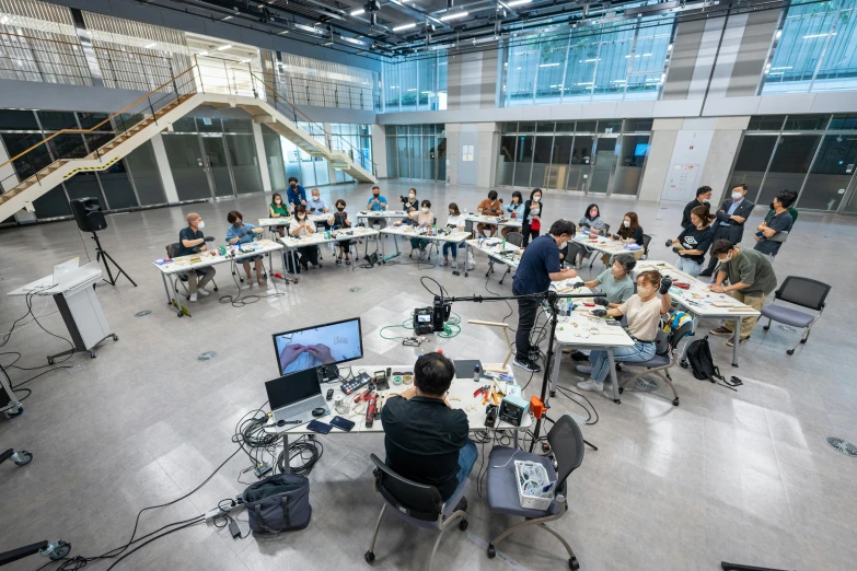 a studio with people recording the workspace