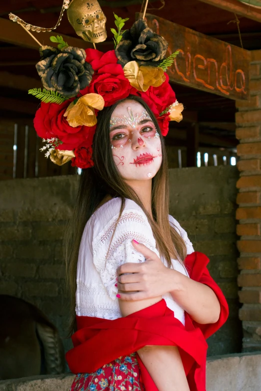 a young lady with white makeup and painted face and flowers