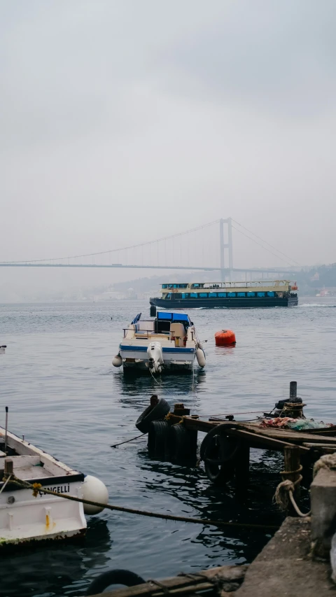 several boats are sitting in the water