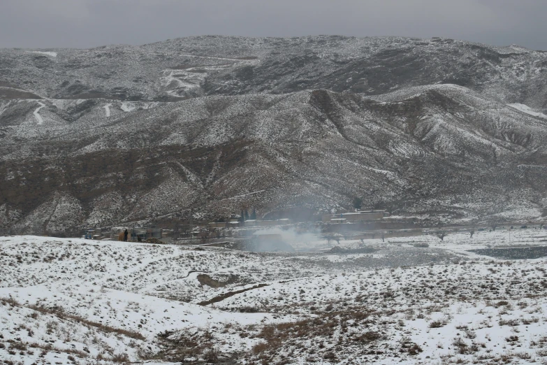 mountains covered with snow are seen in this scenic po