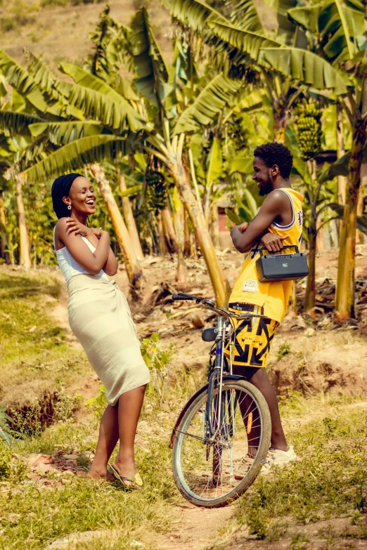 a man standing next to a woman near a bike