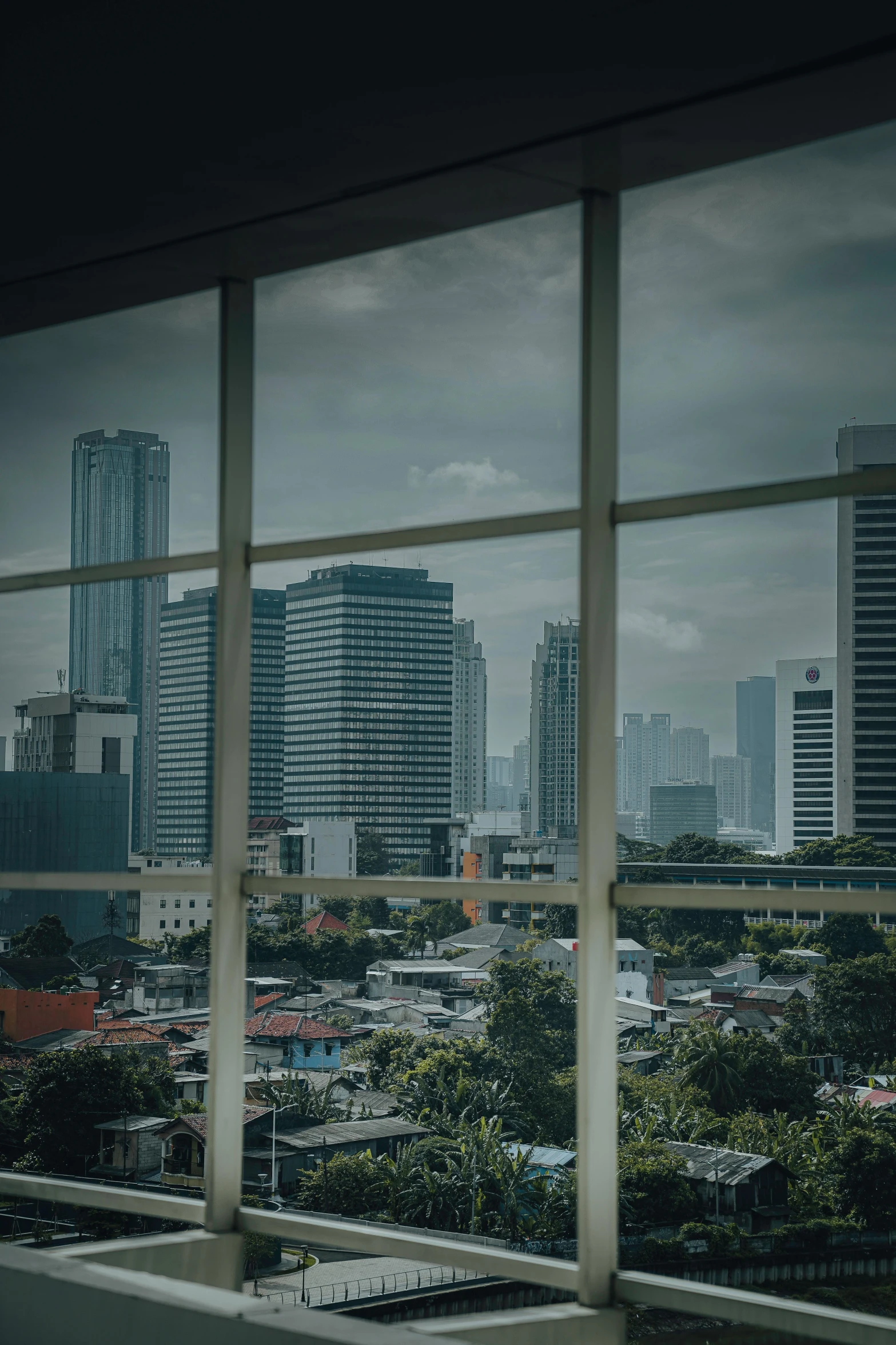 an image of a city seen through a window