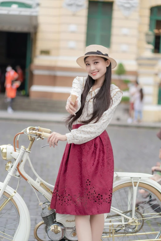 girl with bicycle in the city with a smiling woman