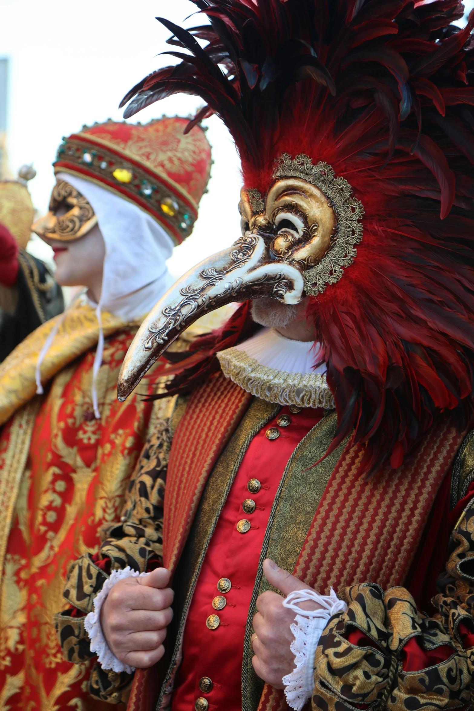 a couple of people with carnival style costumes