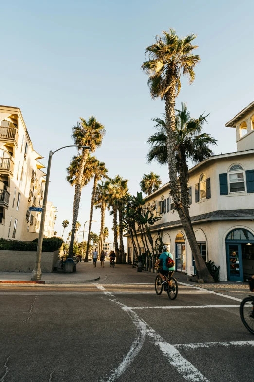 a person rides an unicycle across the street