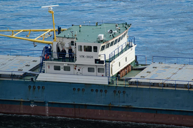 a large boat docked with a crane on it